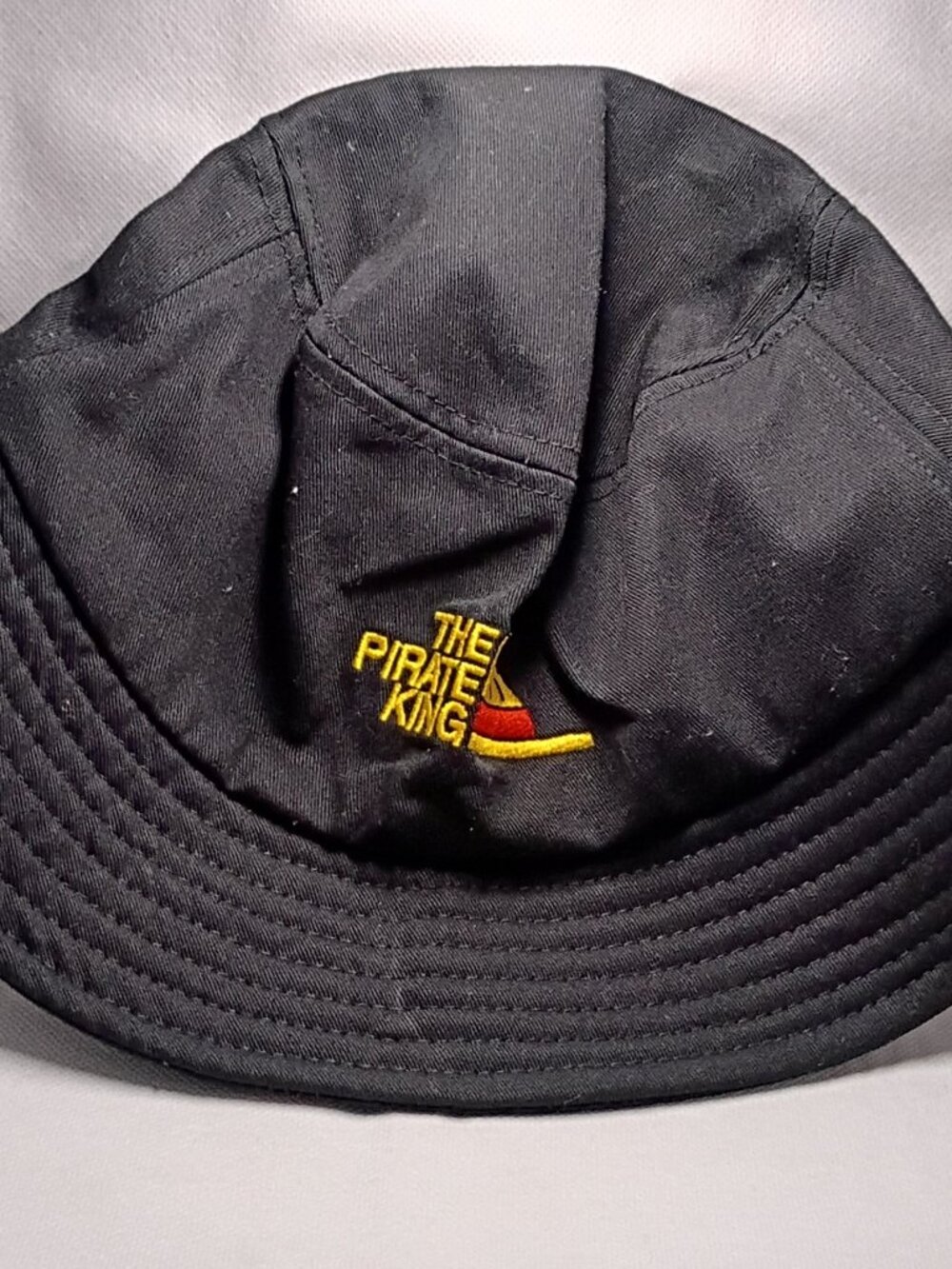 Black Bucket Hat with Embroidered Logo - the pirate king